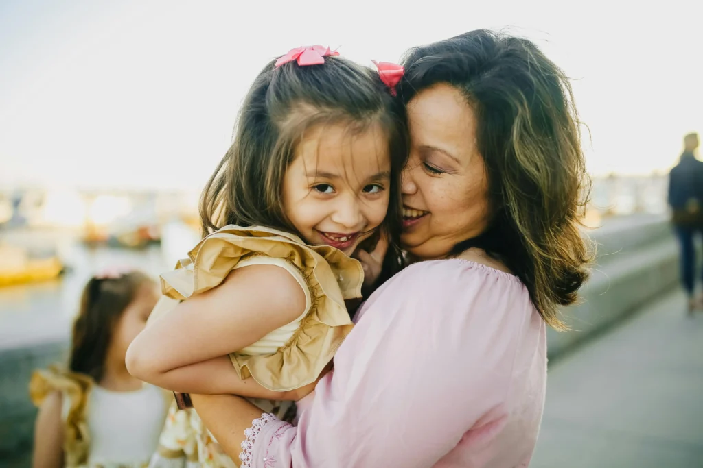 single mother playing with her daughter